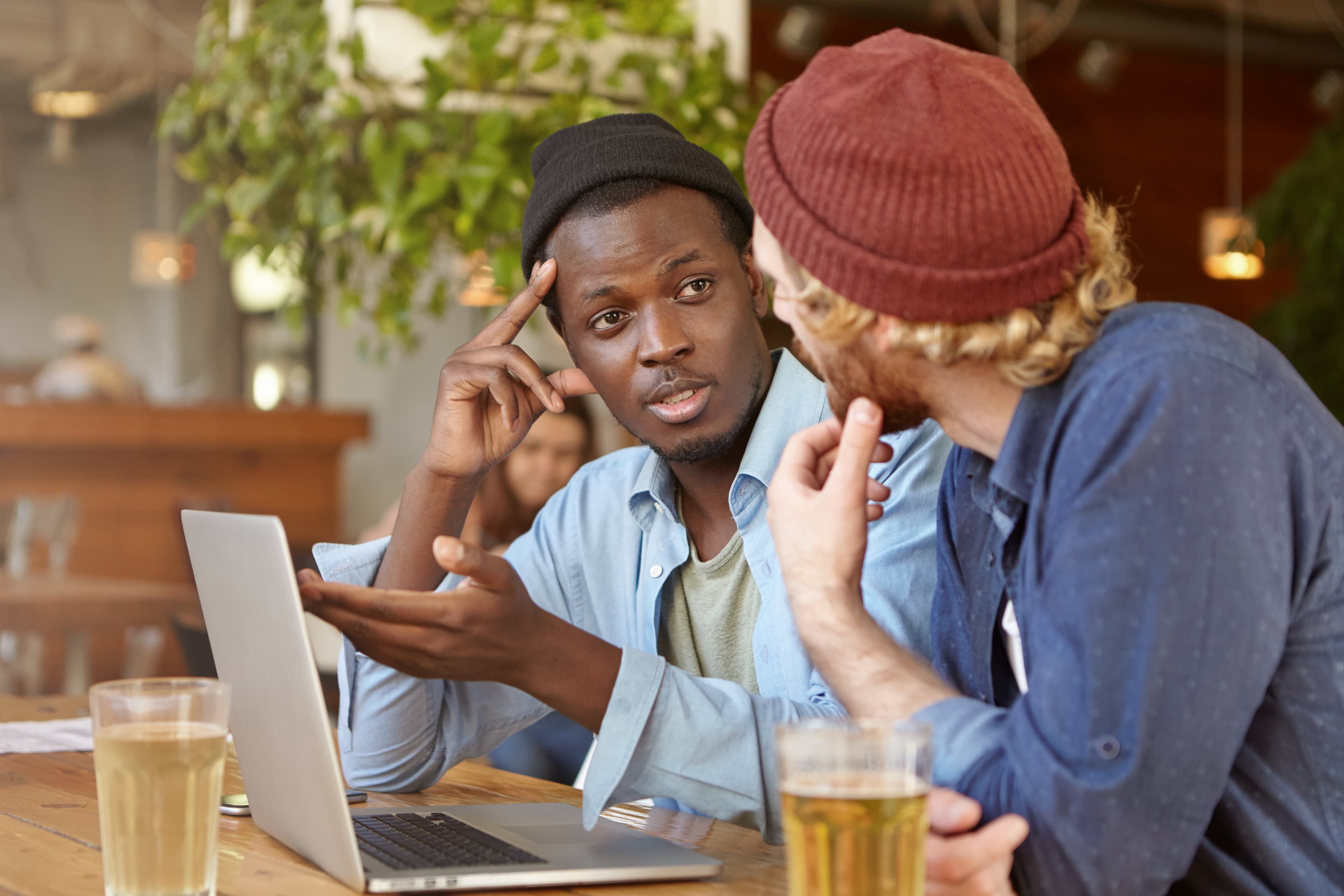 Refugee professionals collaborating on digital work